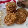 Anzac Biscuits on marble bench with red and white tea towel